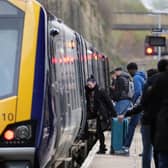 Passengers board train.
