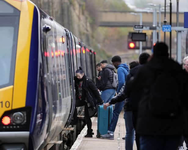 Passengers board train.