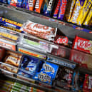 A selection of confectionary and chocolates on a newsagent shelf