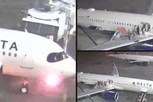 Plane's nose catches fire and passengers evacuate on slide.