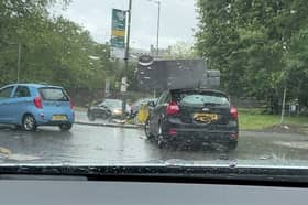 Sofa flies off roof of car and onto busy roundabout.