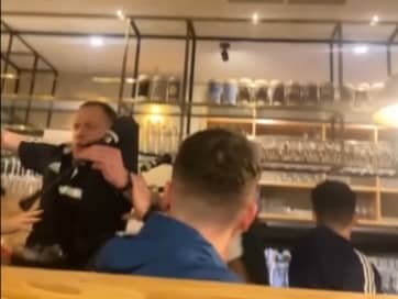 Piper falls off table in pub while entertaining Scotland fans.