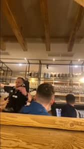 Piper falls off table in pub while entertaining Scotland fans.
