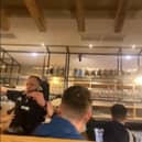 Piper falls off table in pub while entertaining Scotland fans.