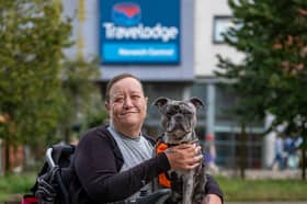 Karen Bishop, 51, with her 2-year-old French bull dog Drew outside the Travelodge in Norwich.