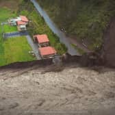 Waves of mud crash through tourist city as landslide kills 6.