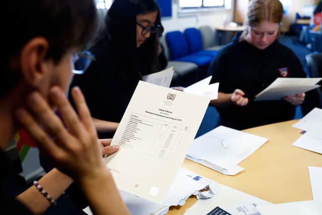 Pupils at Craigmount High receiving their SQA exam results last year. Some students opt to wait and open them together (Photo: Jeff J Mitchell/Getty Images)