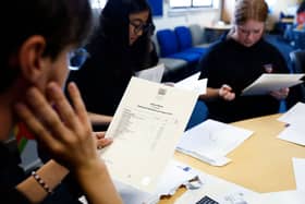 Pupils at Craigmount High receiving their SQA exam results last year. Some students opt to wait and open them together (Photo: Jeff J Mitchell/Getty Images)