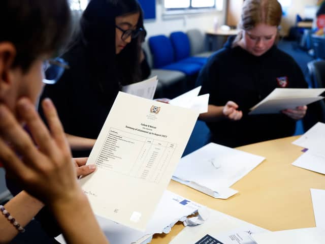 Pupils at Craigmount High receiving their SQA exam results last year. Some students opt to wait and open them together (Photo: Jeff J Mitchell/Getty Images)
