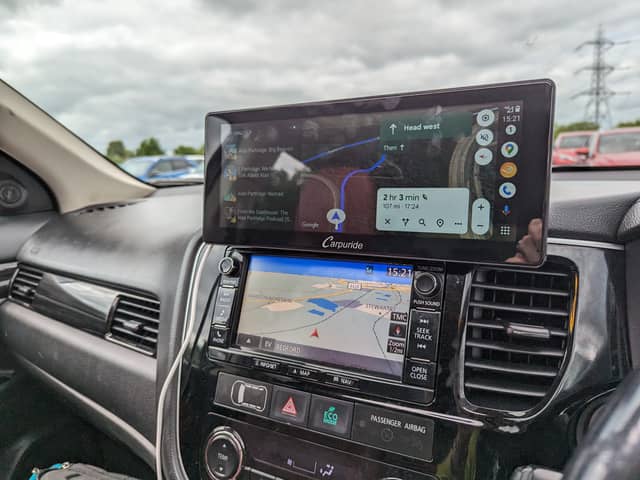The Carpuride W103 sits on top of your dashboard, or on the windscreen, and gives you full access to Android Auto or Apple CarPlay