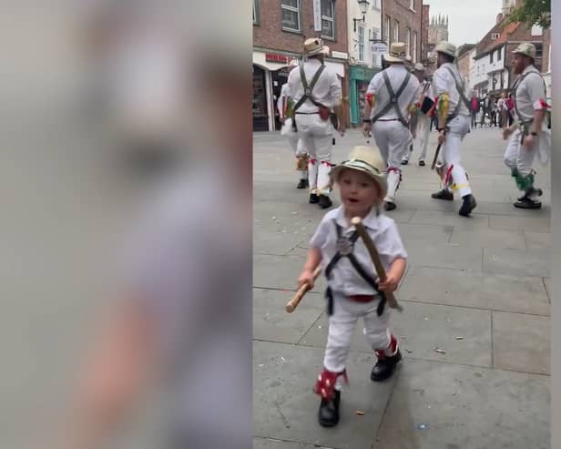 Two-year-old Toby dances along with father’s Morris dance group.