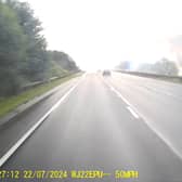 Fire rages through crane on A road as smoke billows into air.