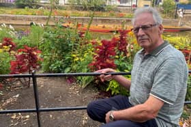 Former councillor Terry Westgate says tourists eager to get the perfect snap have trashed public flowerbeds in an "absolute tragedy' for the city.