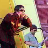 Liam and Noel Gallagher on stage in San Francisco in 1997 (Photo: Dave Hogan/Getty Images)