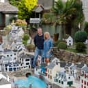 Lee and Julie Gregory with the model of Polperro in Cornwall which is now up for sale.