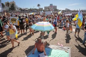 Over-tourism protesters march on a Playa de las Américas beach on October 20 2024.