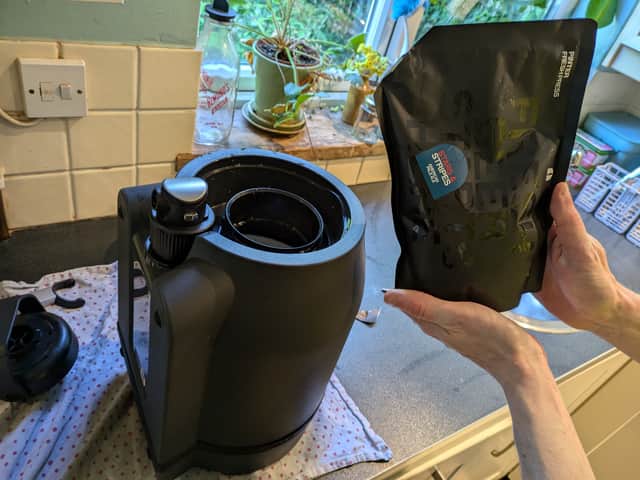Pinter pouring beer ingredients into the keg to get started