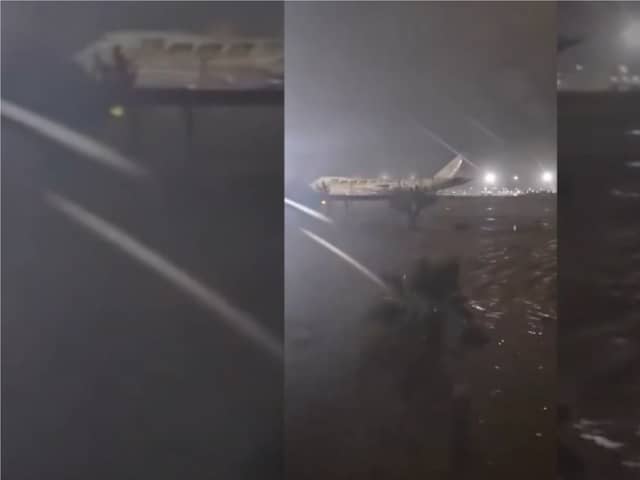 Valencia Airport runway submerged in flood water.