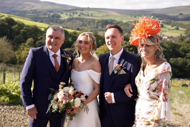 Amy and Harry Totty on their wedding day with Amy's parents Neil and Donna in Holmfirth, Yorkshire.