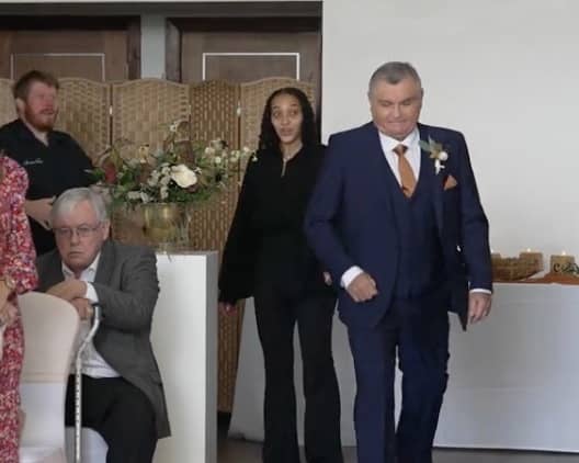 Neil Crossley walks down the aisle at his daughter's wedding, forgetting to take her with him.