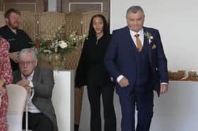 Neil Crossley walks down the aisle at his daughter's wedding, forgetting to take her with him.