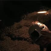 A spider crawls on GK Barry's helmet during the 'Vile Volcano' Bushtucker Trial.