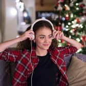 Woman listening to Christmas music.