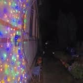 Video grab of a man snipping the Christmas lights at a property in Suffolk. 
