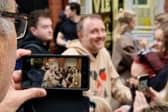 Chris McCausland poses for selfies outside Blackpool Tower during Strictly Come Dancing visit.