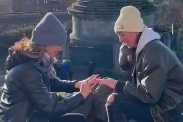 Couple propose to each other at the same time on Calton Hill.