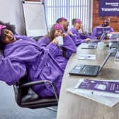 A group of Bensons workers come together to celebrate the humble yawn