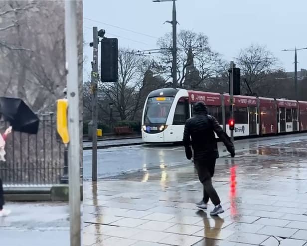 Pedestrians battle Storm Éowyn’s strong winds on Princes Street.