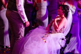 A bride given less than six months to live after losing her leg to cancer made it down the aisle to marry her partner -for the second time. 