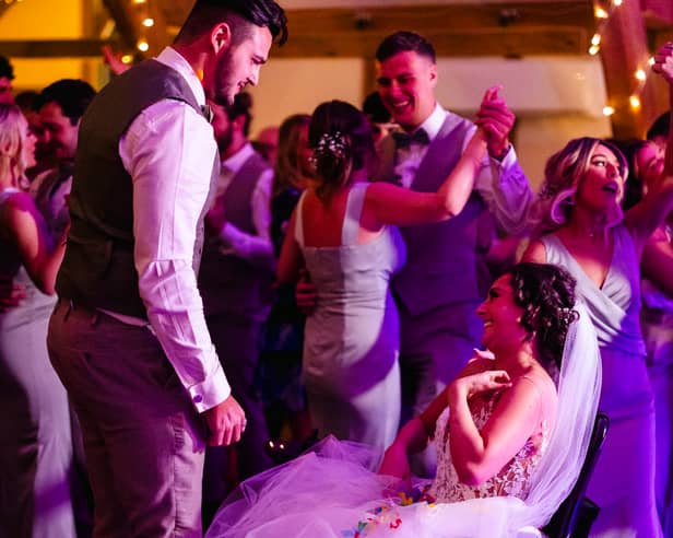 A bride given less than six months to live after losing her leg to cancer made it down the aisle to marry her partner -for the second time. 