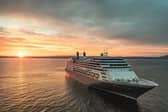 Borealis at sea at sunset