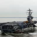 A fighter jet fell off the side of the American aircraft carrier USS Harry S. Truman while she was deployed in the Red Sea.
