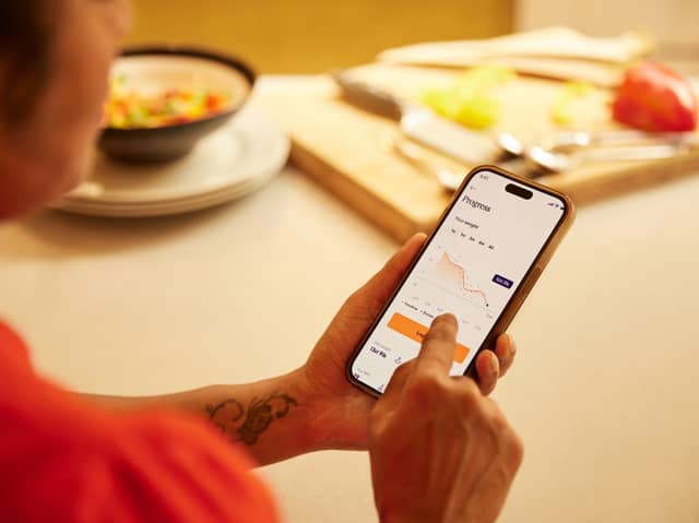 Tracking weight loss progress using the Voy app, part of a behaviour-led programme supporting Wegovy and Mounjaro users.