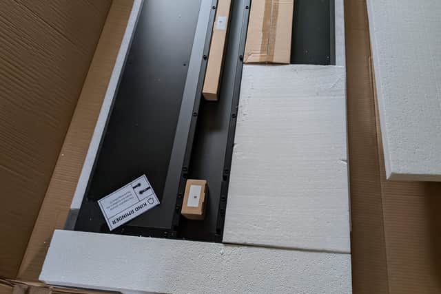 It comes flat-packed, but it's really easy to assemble