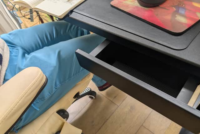 The drawer is a tad small, but it attaches with a magnet, and can be moved around
