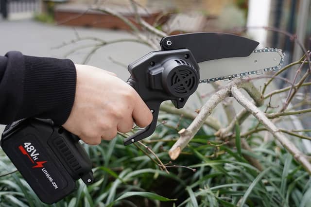 The Timber Titan 6-Inch Mini Chainsaw: for real men only.