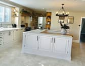 Mrs Hinch uses adjustable organisers to keep things like food neatly organised in her kitchen (pictured).