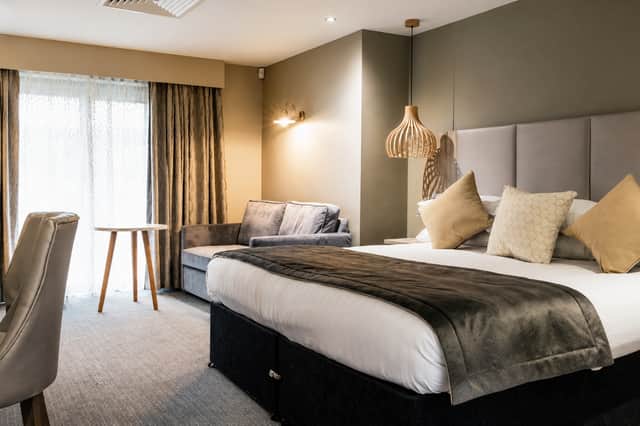 One of the stylish boutiques suites at Moddershall Oaks, with contemporary neutral décor, a spacious bed and plenty of room to unwind between spa sessions.