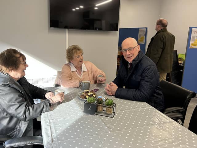 Mr Swinney heard from residents about the difficulties faced by the community following Storm Babet.