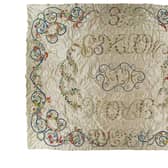 ​An elaborate bed cover worked by Lady Augusta Gordon.