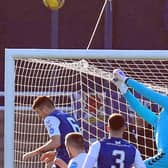 Montrose 'keeper Allan Fleming punches clear from a Cove attack. Fleming deputised after Aaron Lennox was injured in the warm-up (picture by Phoenix Photography)