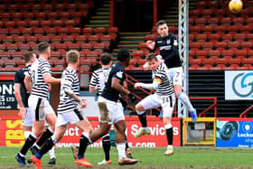 Graham Webster with a header on goal during the weekend's win. Pic by Phoenix Photography