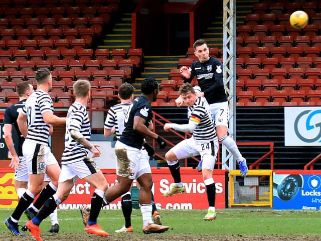 Graham Webster with a header on goal during the weekend's win. Pic by Phoenix Photography