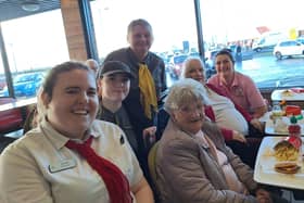 ​Jean Burness is pictured with fellow residents and McDonald’s staff.