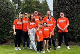 ​Holly is pictured with her mum Carly and the other family members who took on the walk.