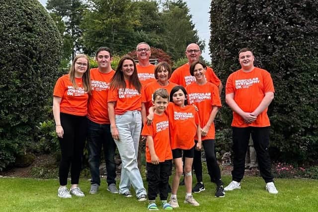 Holly is pictured with her mum Carly and the other family members who took on the walk.